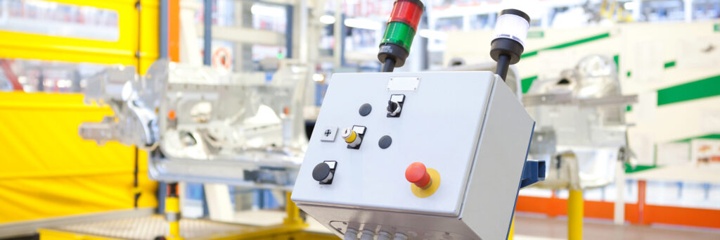 How does an emergency stop button work?